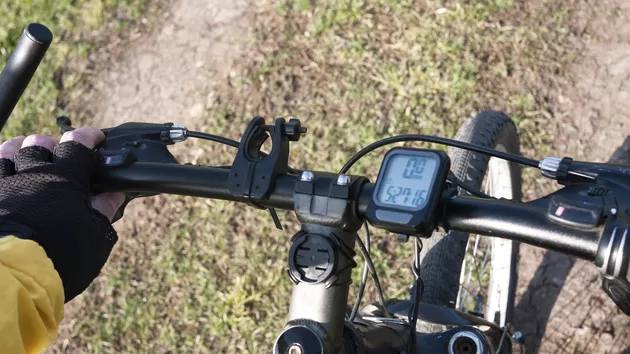 How to Bicycle Speedometer Setup - Attach the computer display mount on the handlebar